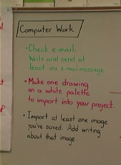 teacher and student with computer