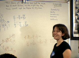 student at board smiling