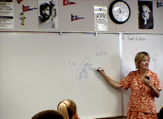 teacher writing on board
