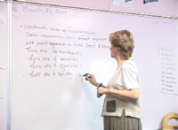 teacher at board writing
